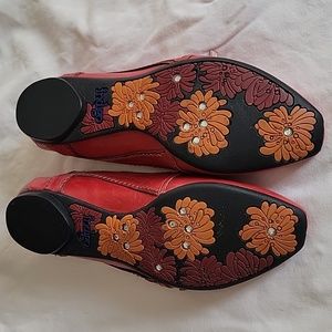 Women's Clarks Indigo red flats. Size 6. Rhinestones on soles of shoes.
